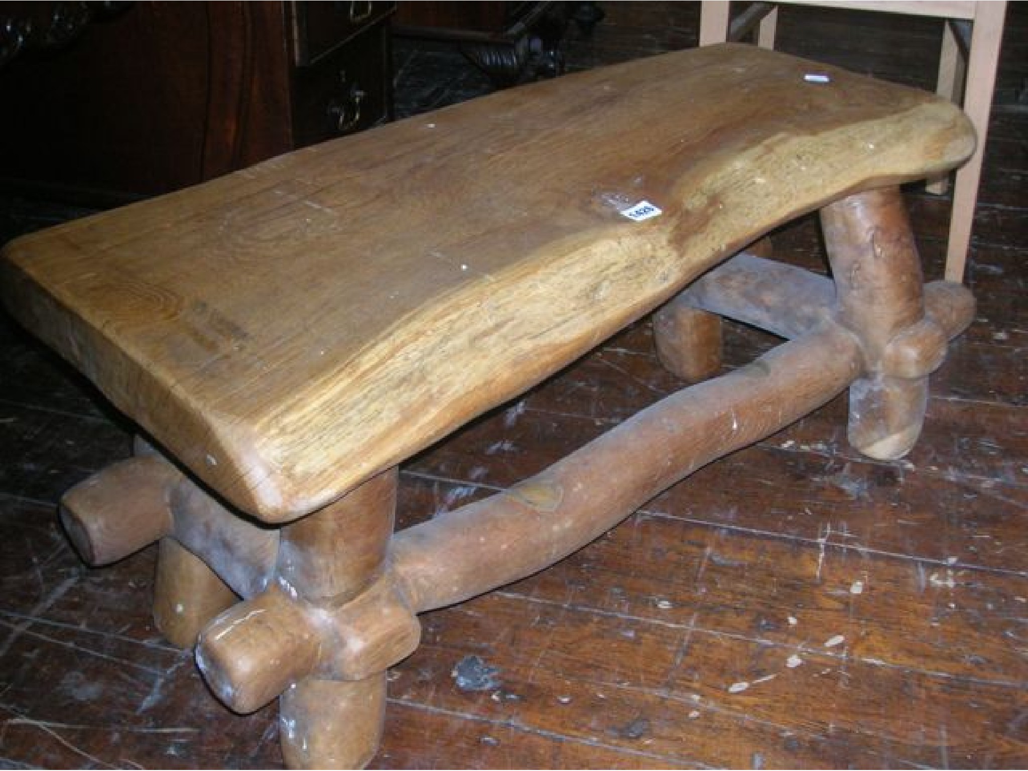 Appraisal: A rustic oak coffee table cut from the solid of