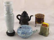 Appraisal: A bronze miniature teapot a brass circular pot on three