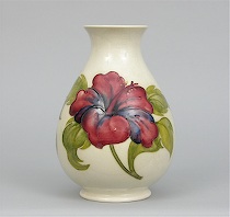 Appraisal: Moorcroft Hibiscus Vase Bulbous shape-bottom heavy with small foot and