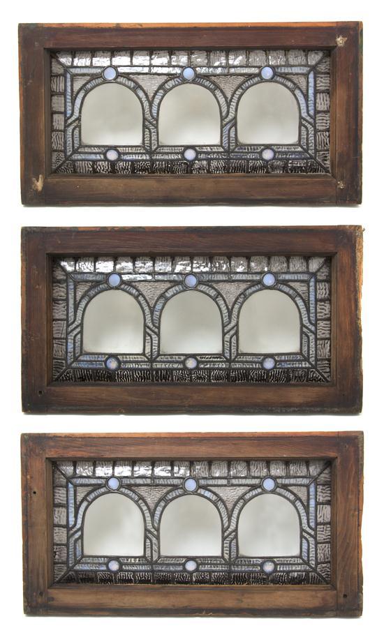 Appraisal: A Set of Three Jeweled and Leaded Glass Windows each