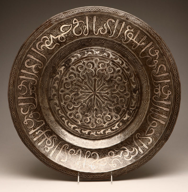 Appraisal: A Middle Eastern silver-inlaid iron charger Probably th century of