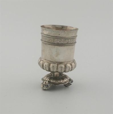 Appraisal: A late th century German beaker on three pomegranate feet