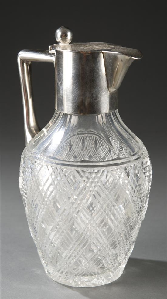 Appraisal: German cut crystal claret jug with silver top Bulbous cut