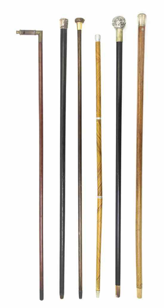 Appraisal: A Collection of Five Walking Sticks comprising two English silver