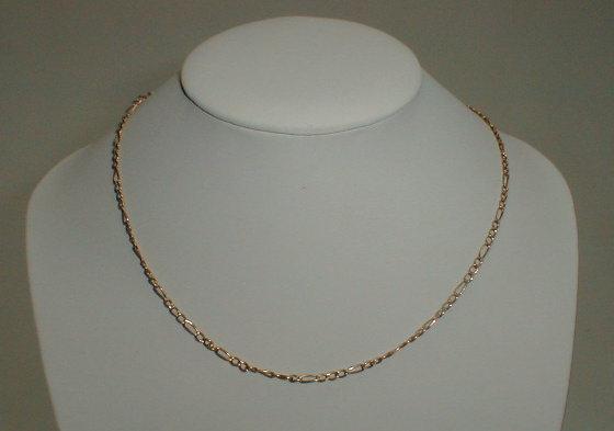 Appraisal: An open link light weight neck chain stamped