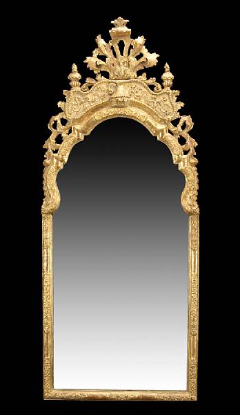 Appraisal: A Swedish Baroque style giltwood mirror th century The arched