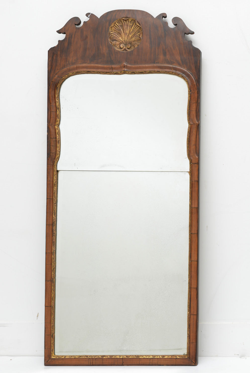 Appraisal: GEORGE II PARCEL GILT WALNUT PIER MIRROR th c shell