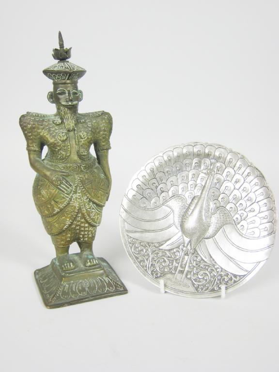 Appraisal: An Indian silver Dish decorated with a peacock in and