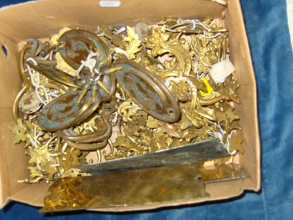 Appraisal: A quantity of cast gilt metal furniture fittings including handles