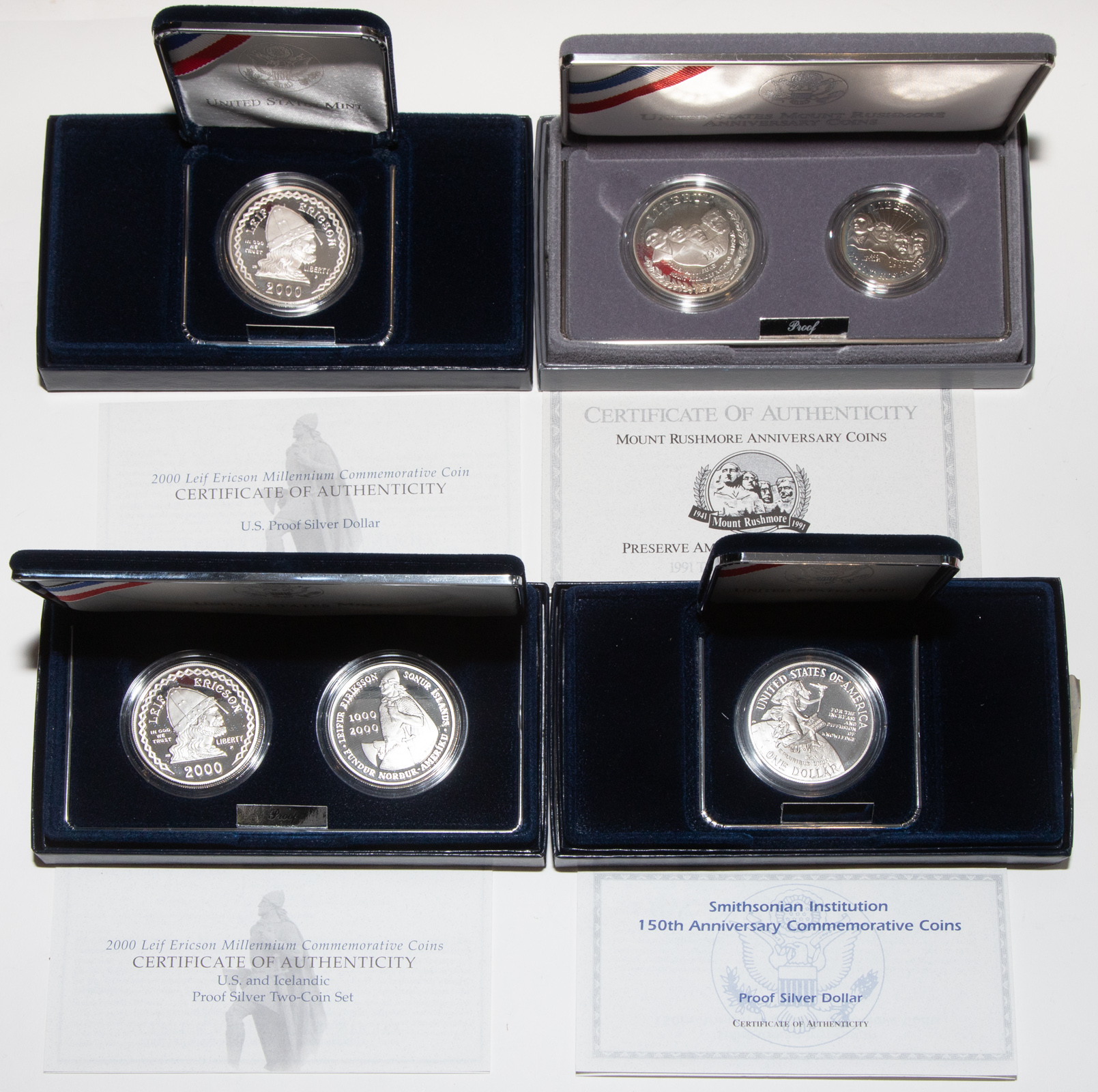 Appraisal: FOUR COMMEMORATIVE SILVER SETS Leif Erickson Proof Silver Dollar Set