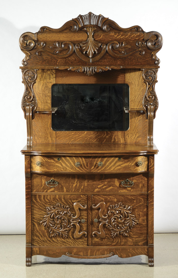 Appraisal: LATE VICTORIAN CARVED OAK SIDEBOARD American c in two sections