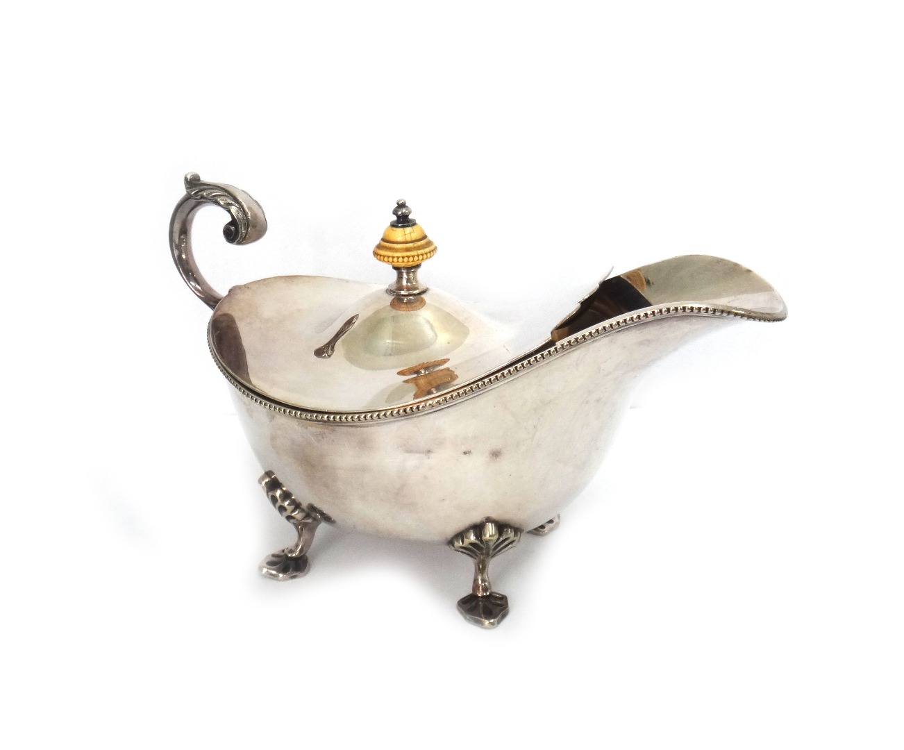 Appraisal: A pair of electroplated sauceboats with beaded borders flying scroll