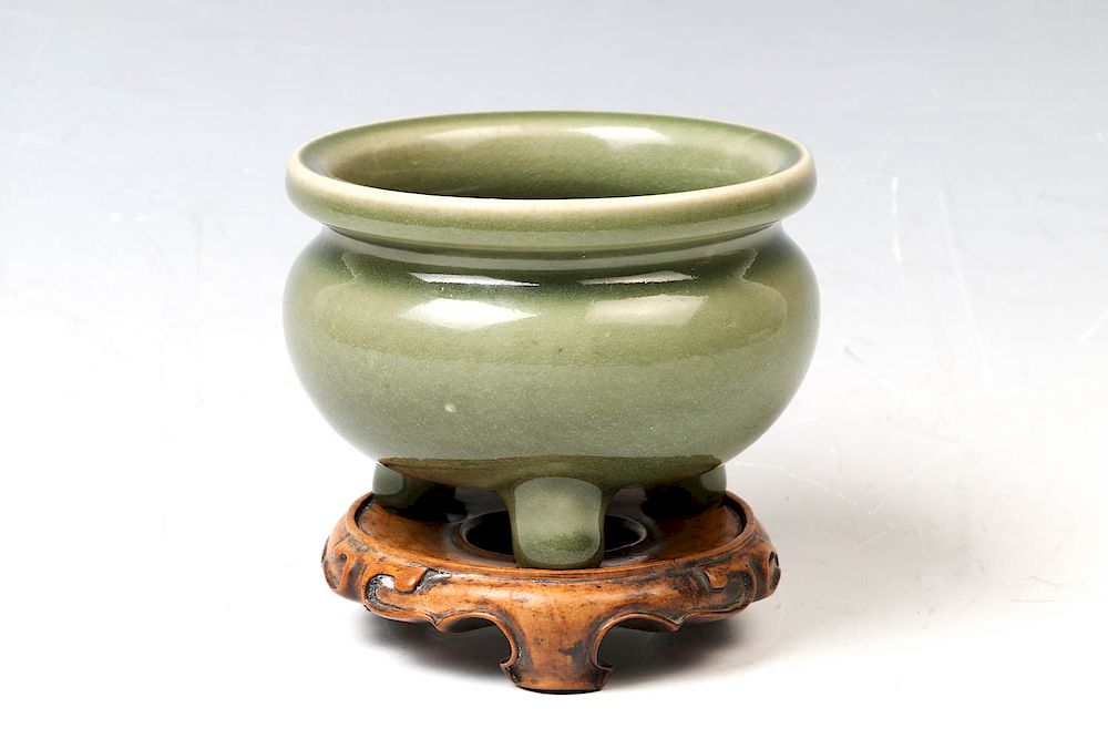 Appraisal: CELADON TRIPOD CENSER WITH STAND the compressed globular body rising