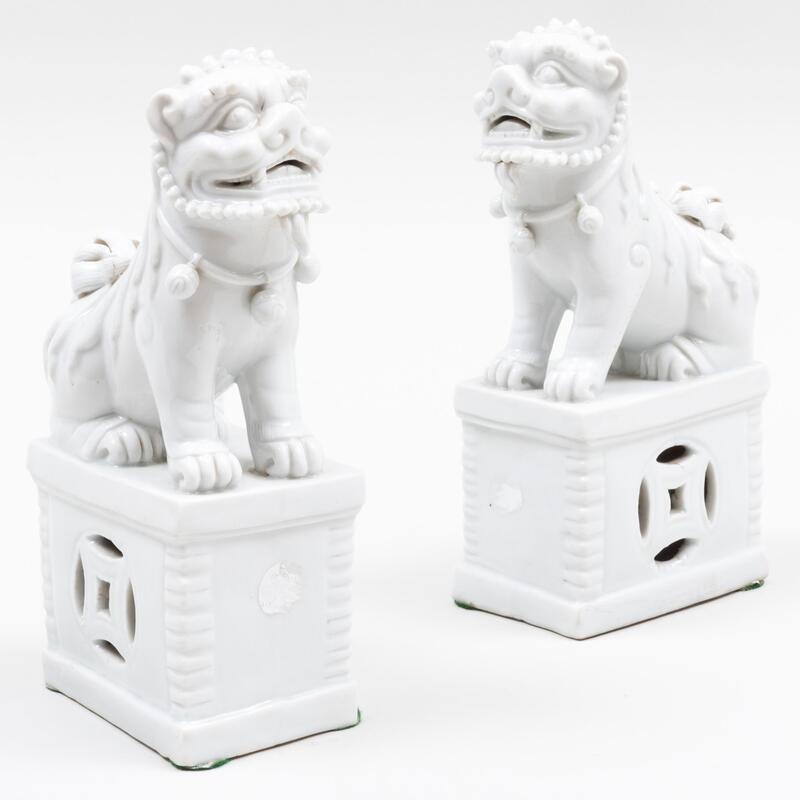 Appraisal: Pair of Chinese White Glazed Porcelain Buddhistic Lion Joss Stick