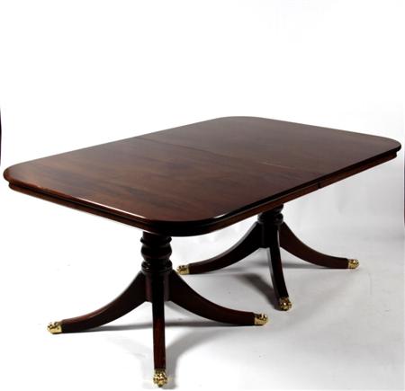 Appraisal: A Regency style mahogany dining table the rounded rectangular top