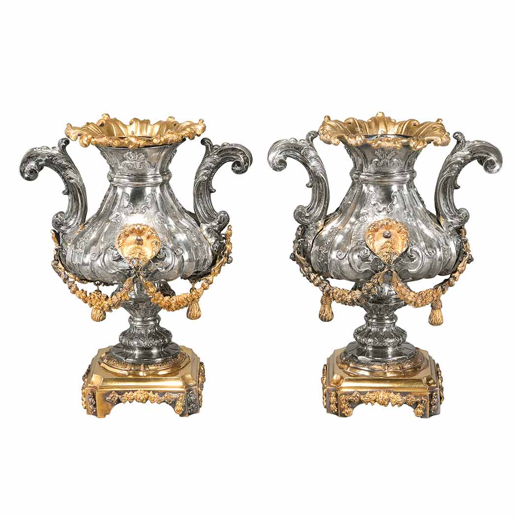 Appraisal: Pair of Continental Rococo Gilt-Bronze Mounted Silver Urns th th