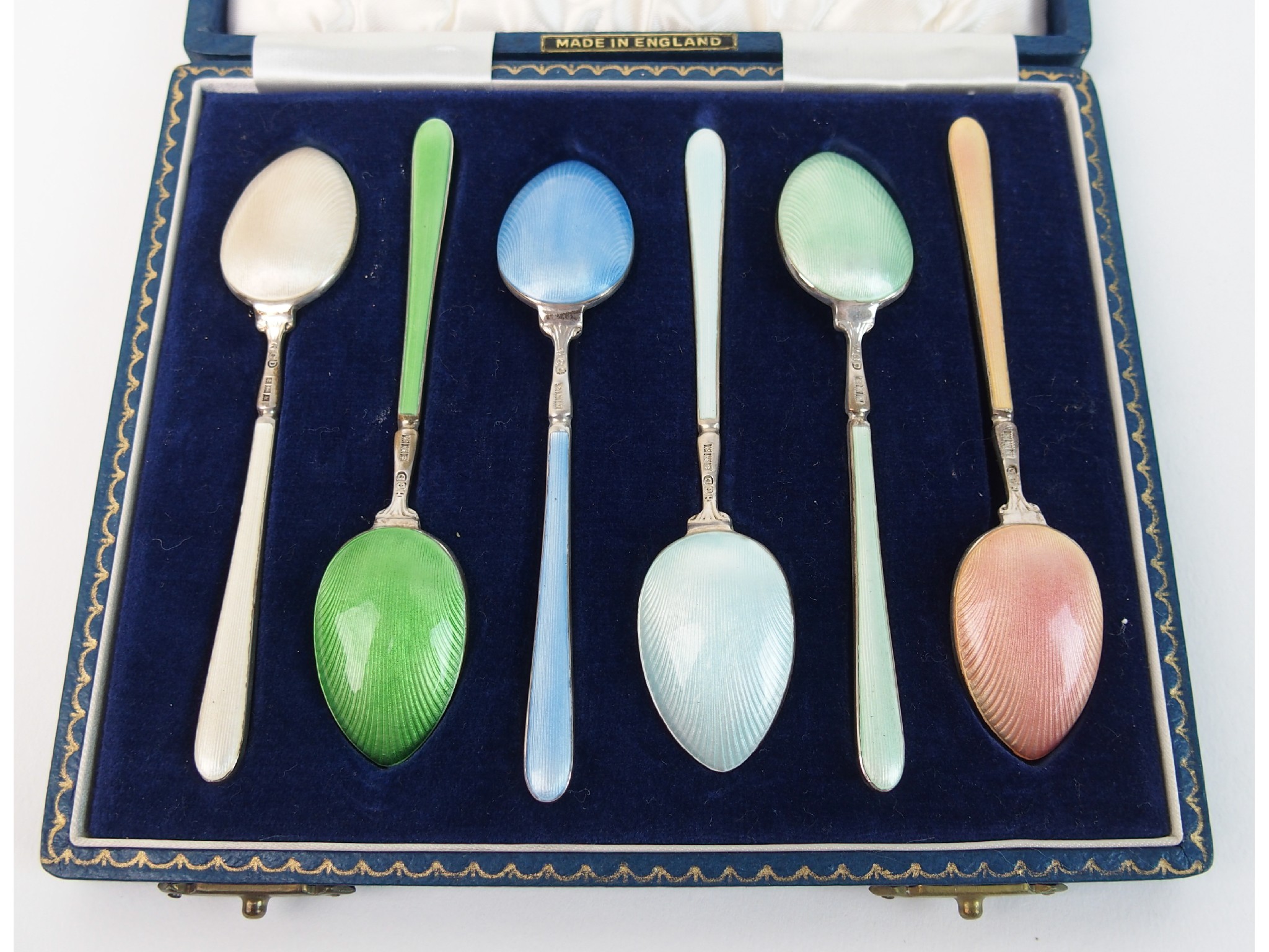 Appraisal: A cased set of six silver and enamel coffee spoonsby