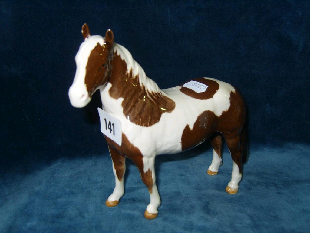 Appraisal: A Beswick model of a brown and white Pinto type