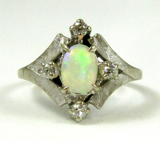 Appraisal: OPAL DIAMOND AND FOURTEEN KARAT WHITE GOLD RING with four