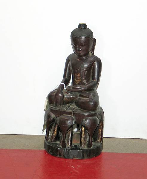 Appraisal: A carved wood figure of a Buddha th th Century