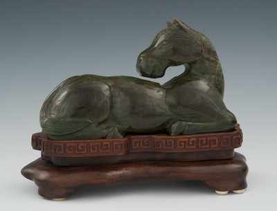 Appraisal: A Carved Oriental Hardstone Horse on Wood Stand The dark