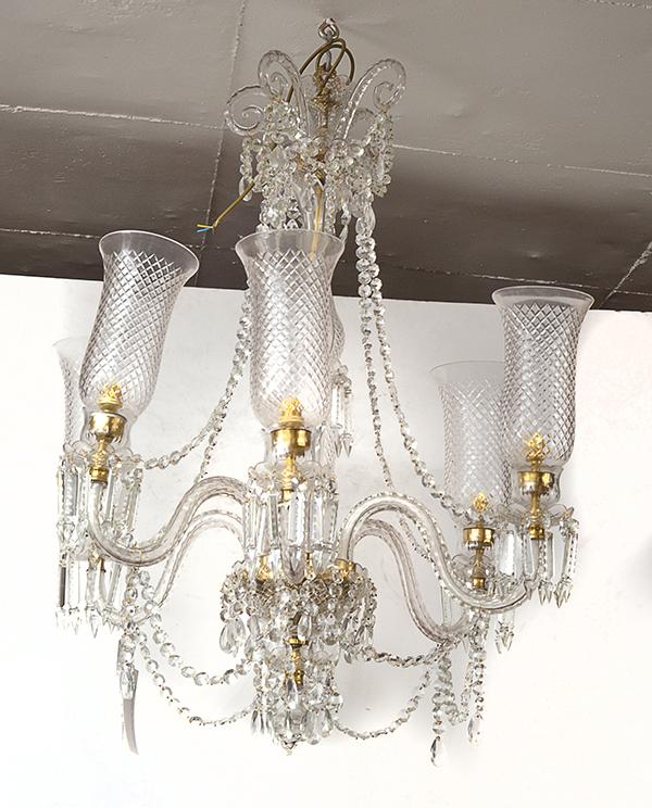 Appraisal: A CRYSTAL CHANDELIER with a fluted stem and six scroll