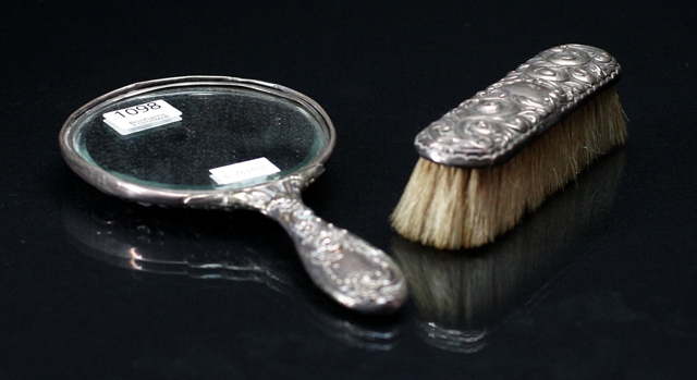 Appraisal: A silver hand mirror marked STERLING together with a Sterling