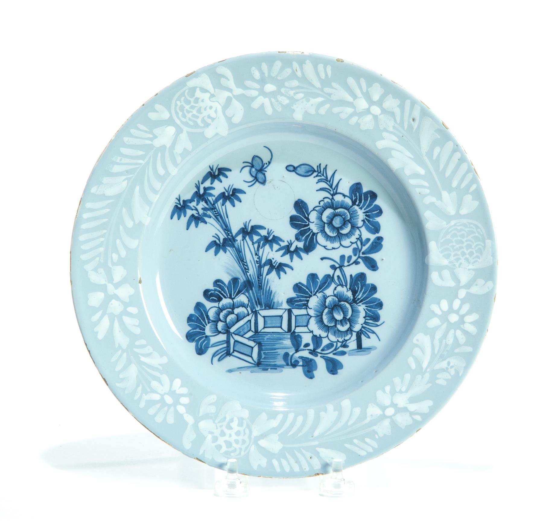 Appraisal: ENGLISH DELFT PLATE Eighteenth century Blue Asian-style garden on pale