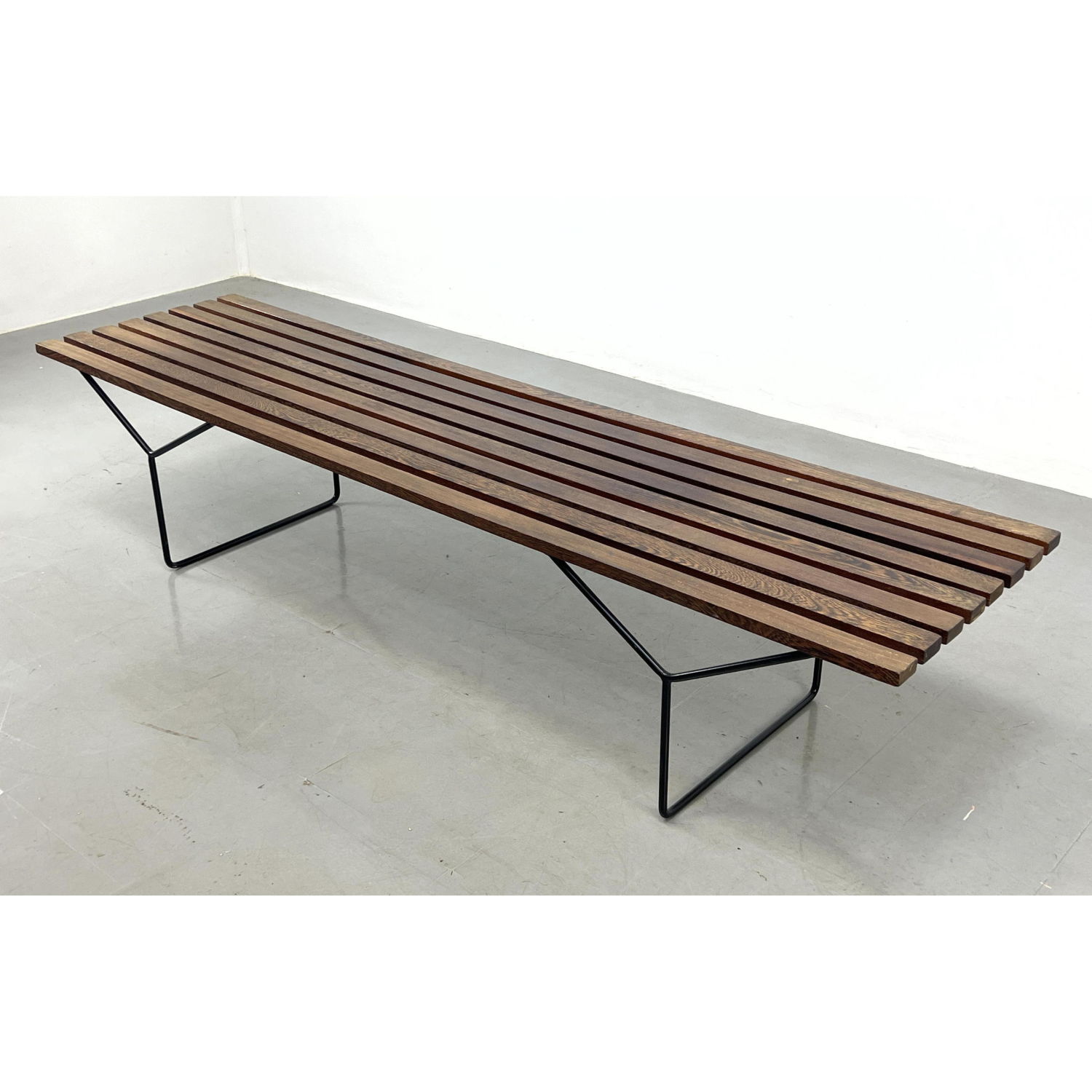 Appraisal: Harry Bertoia style Slat Bench Dark stained slats on black