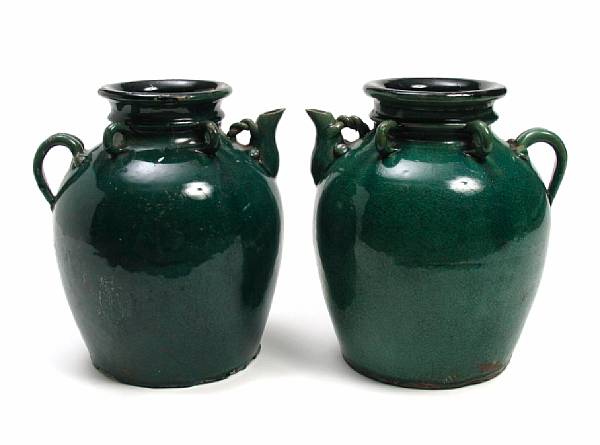 Appraisal: A pair of Chinese green glazed jars height in width