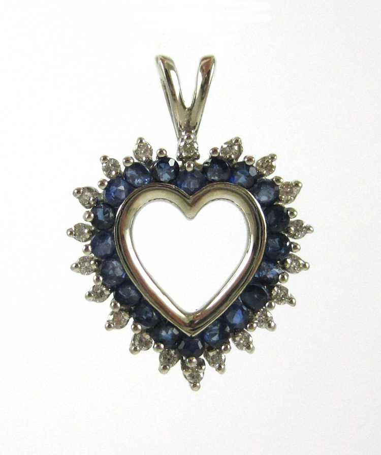 Appraisal: SAPPHIRE DIAMOND AND FOURTEEN KARAT GOLD PENDANT The white gold