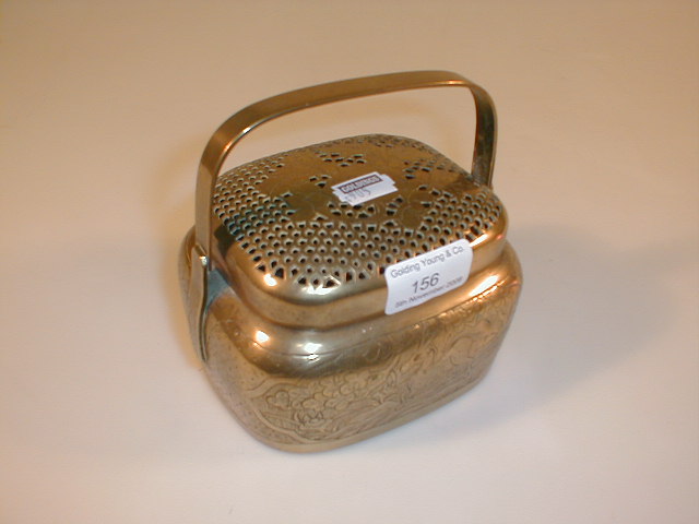 Appraisal: A Chinese brass cricket box with pierced cover and loop