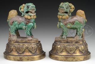 Appraisal: PAIR OF POTTERY FOO DOG STATUES MOUNTED AS BOOKENDS PAIR