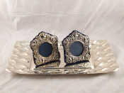 Appraisal: A pair of silver plate faced photo frames together with