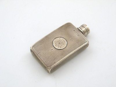 Appraisal: A Victorian silver hipflask of shaped rectangular form engine turned