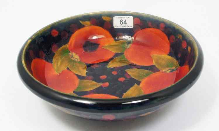 Appraisal: Moorcroft Footed Bowl decorated inside and out with Pomegranates diameter