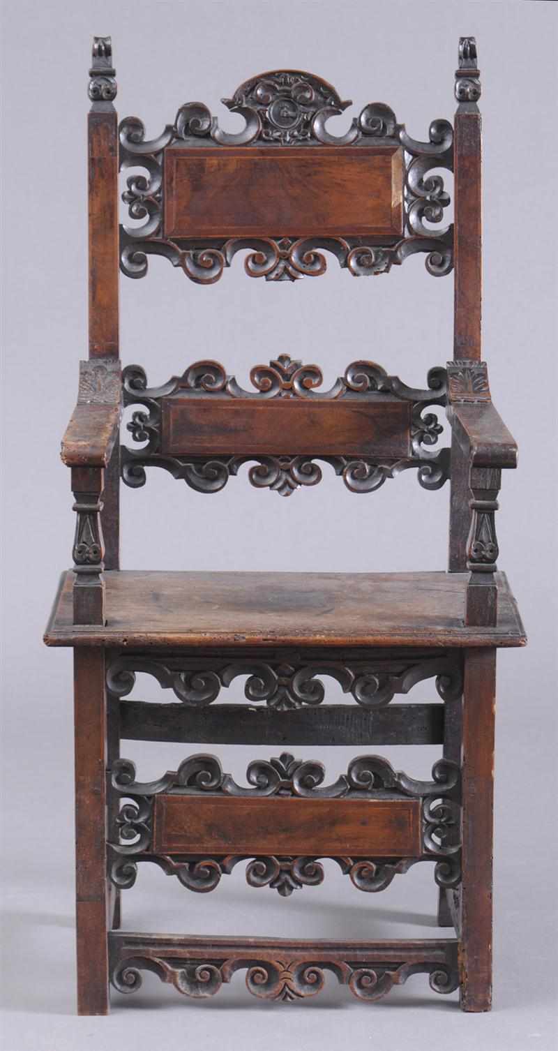 Appraisal: ITALIAN BAROQUE CARVED AND INLAID WALNUT ARMCHAIR The shaped crest