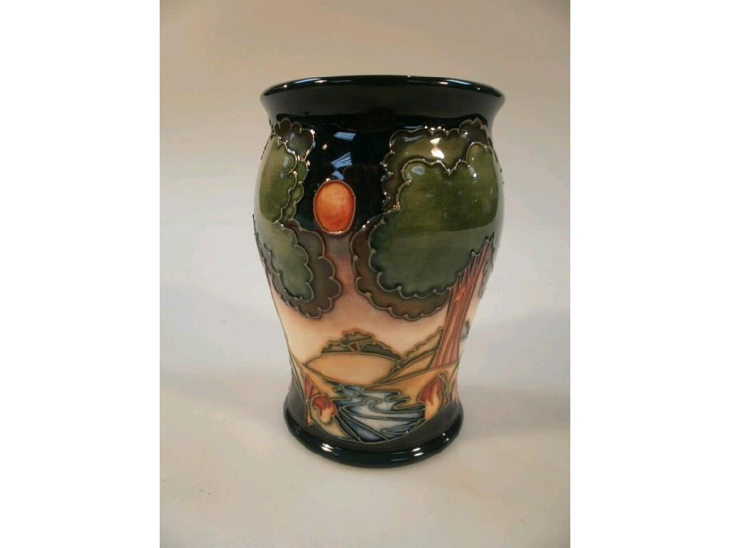 Appraisal: A Moorcroft squat baluster vase with landscape and river decoration