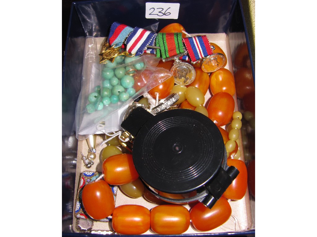 Appraisal: Lot comprising costume beads a compass and a miniature set