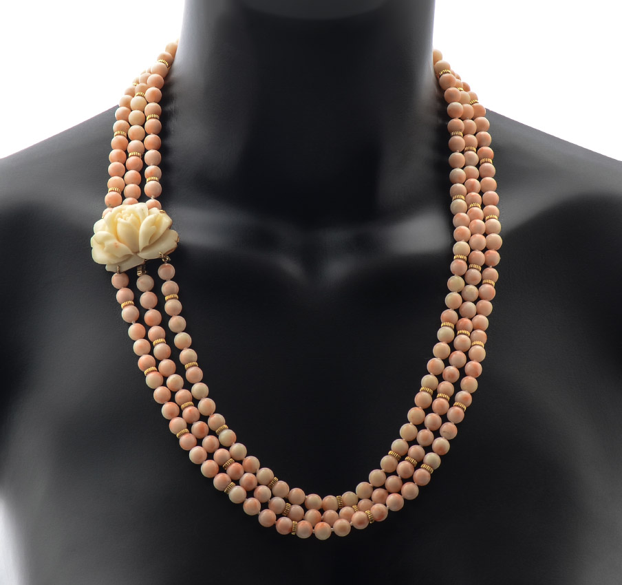 Appraisal: CARVED CORAL THREE STRAND BEAD NECKLACE Triple strand necklace of