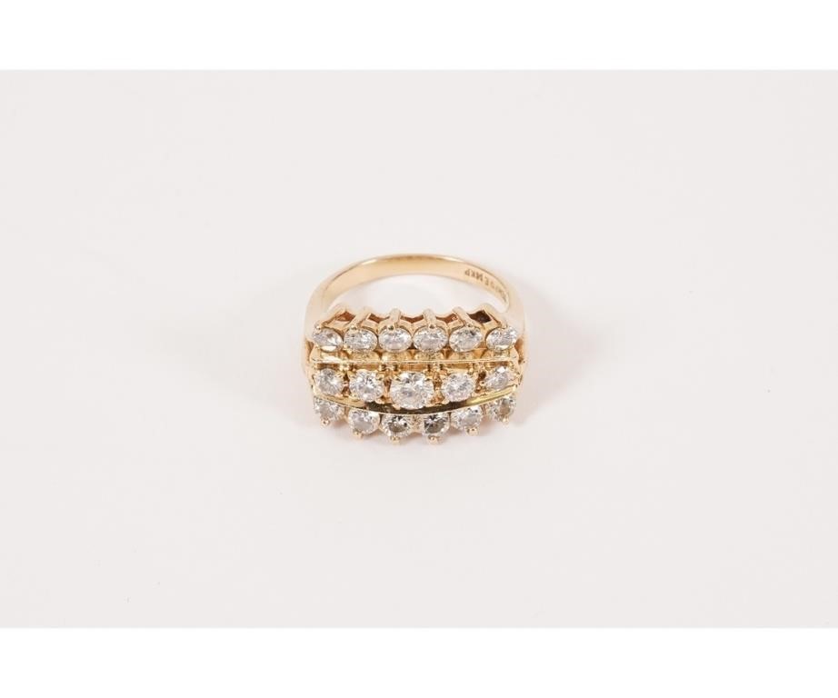 Appraisal: Diamond cocktail ring of cast yellow gold with three rows