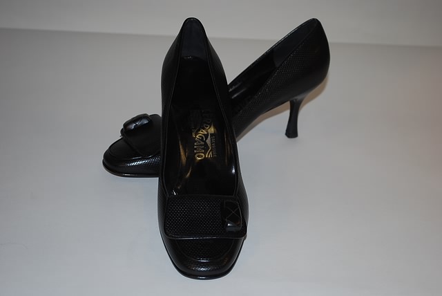 Appraisal: Salvatore Ferragamo black textured leather pump w flap and button