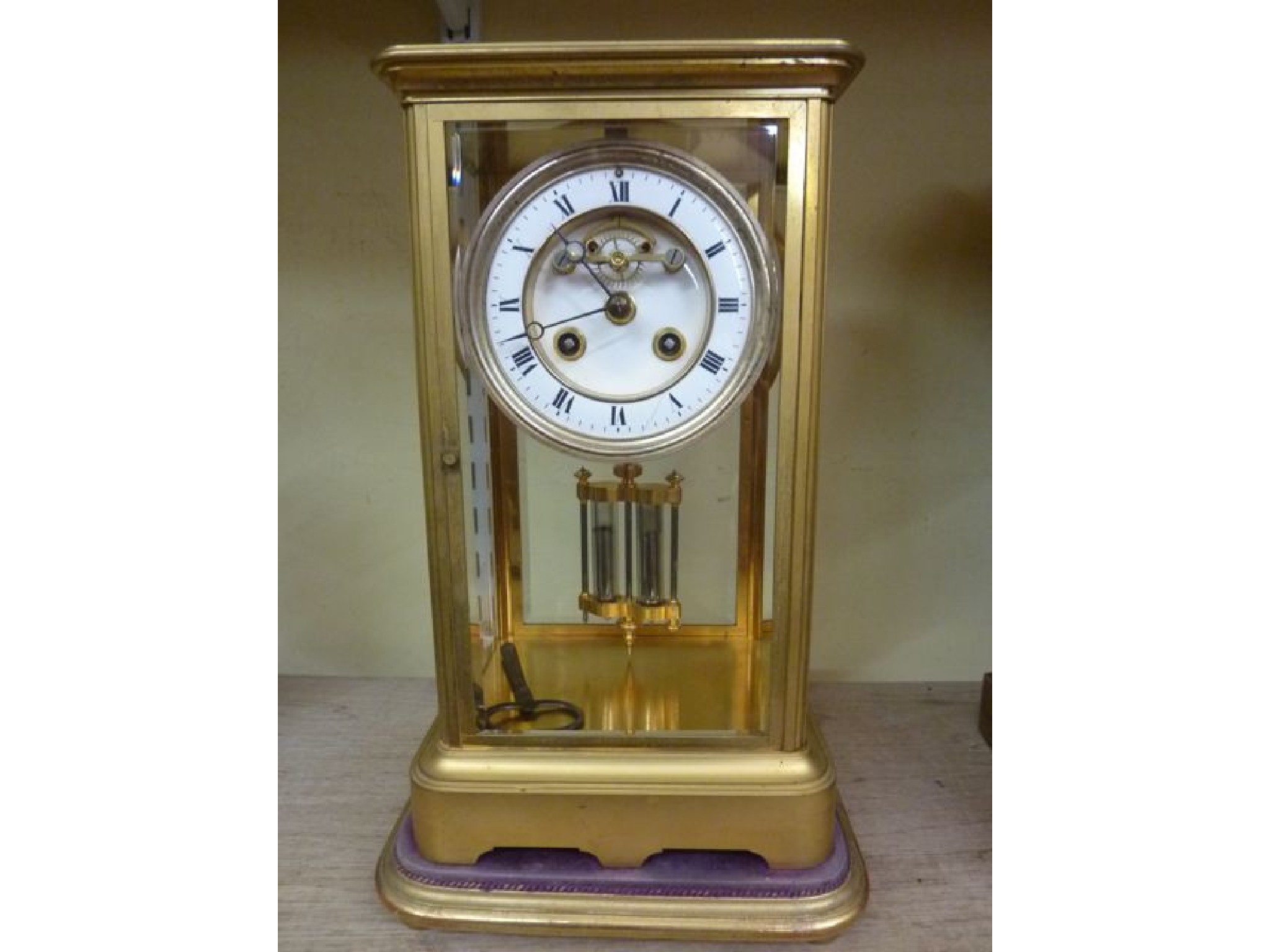 Appraisal: A th century brass cased four pane mantle clock with