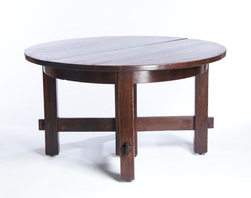 Appraisal: GUSTAV STICKLEY Rare and early five-leg dining table with overhanging