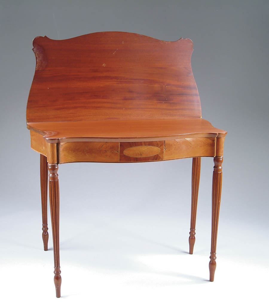 Appraisal: SHERATON MAHOGANY INLAID CARD TABLE Serpentine front with central rectangle