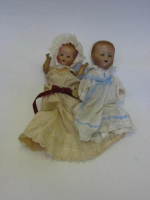 Appraisal: An Armand Marseille bisque head baby doll with blue glass