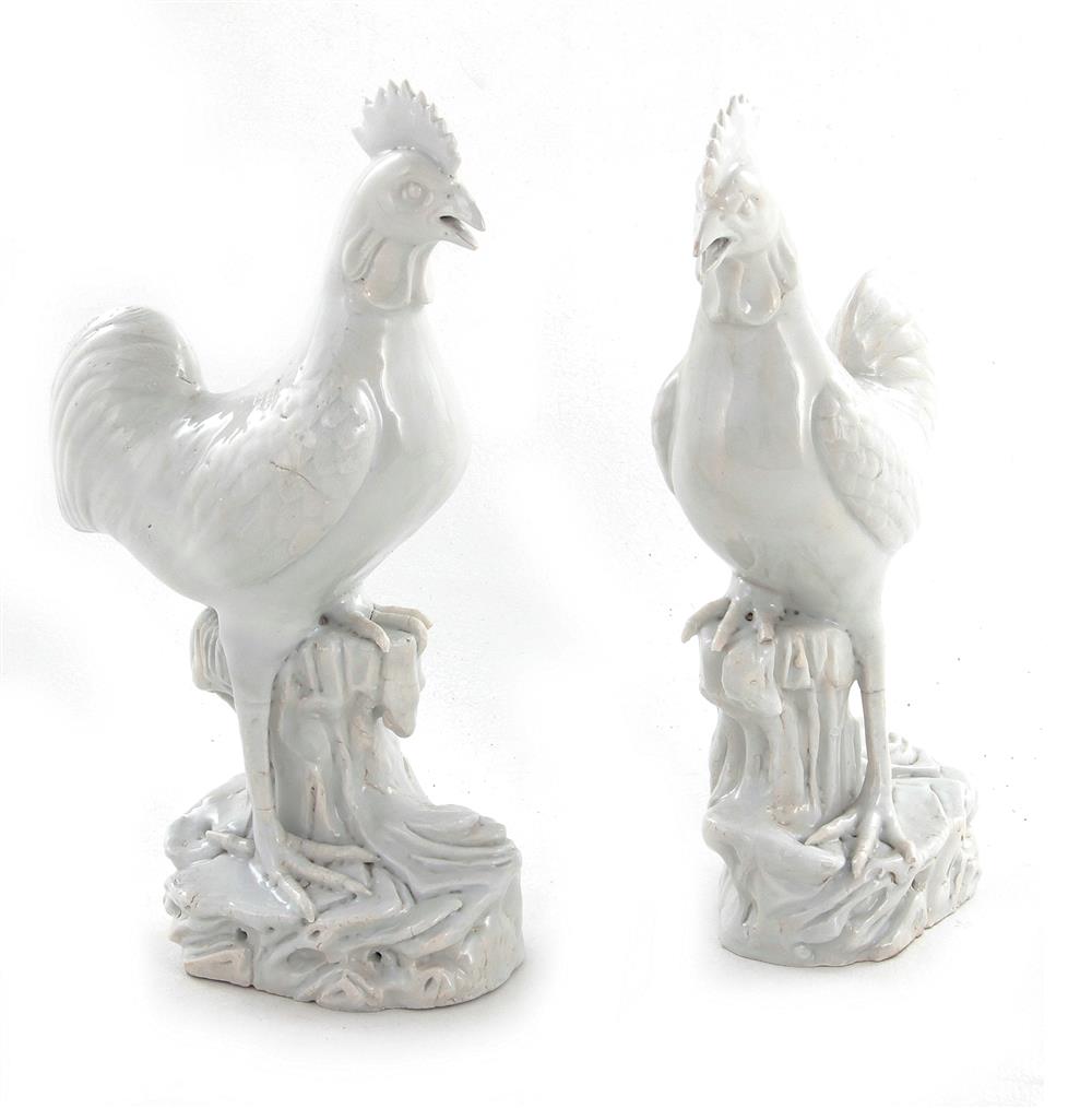 Appraisal: Pair Chinese white porcelain roosters Qing dynasty standing on tree