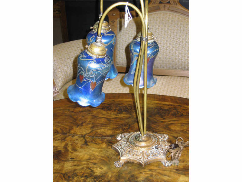 Appraisal: AMERICAN METAL AND ART GLASS FLORIFORM TABLE LAMP With cast