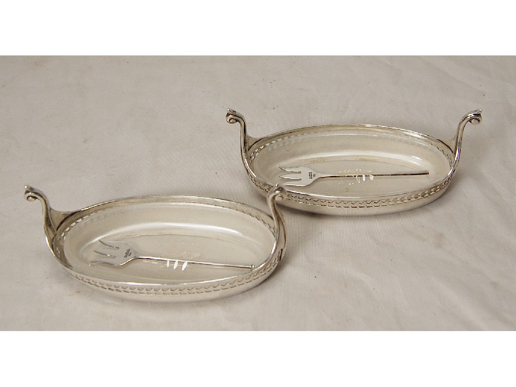 Appraisal: Pair of silver oval anchovy dishes in form of long