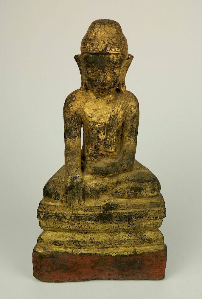 Appraisal: Carved wood and painted Buddha th thc Carved and painted